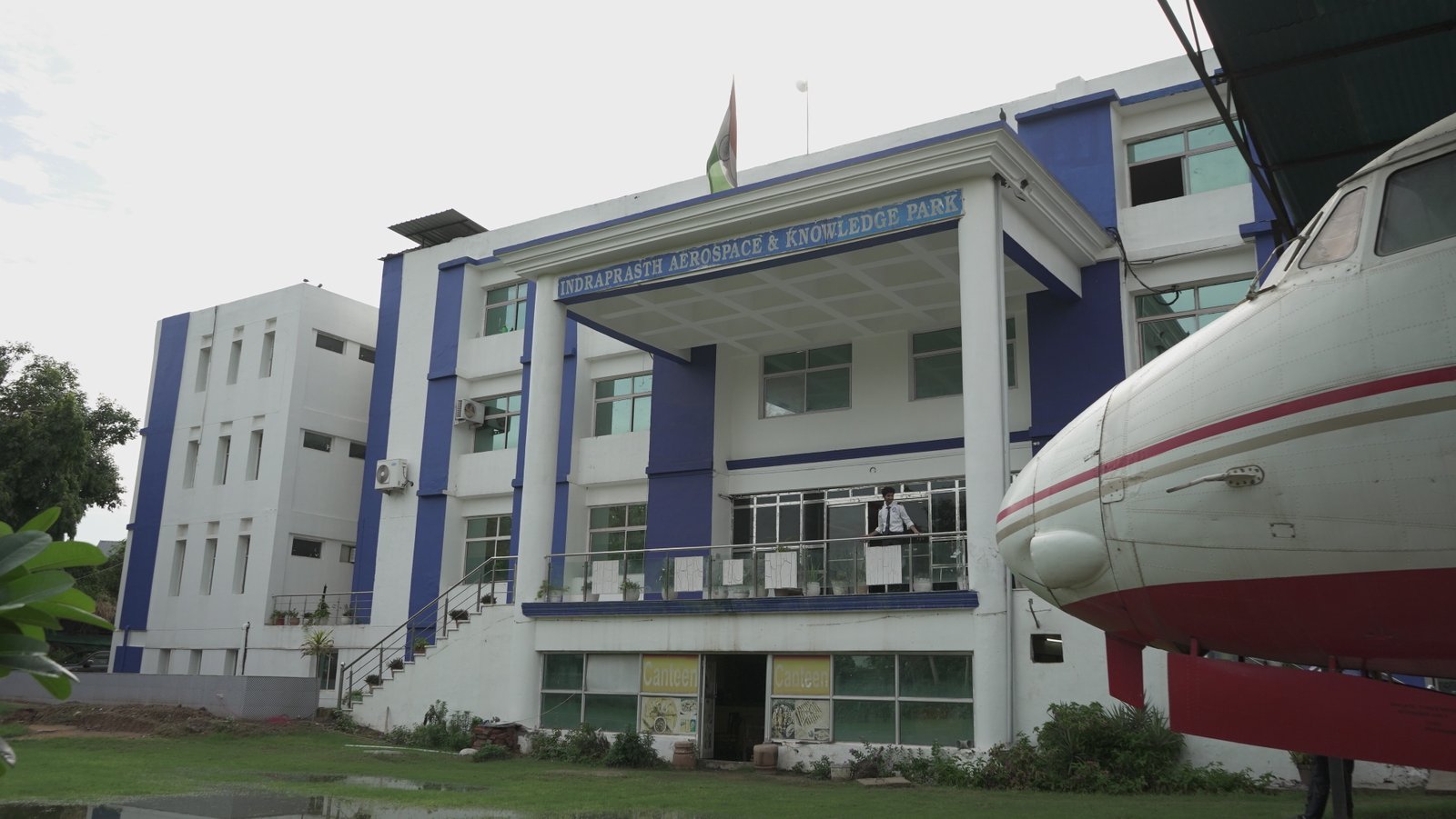 Air hostess walking near aircraft